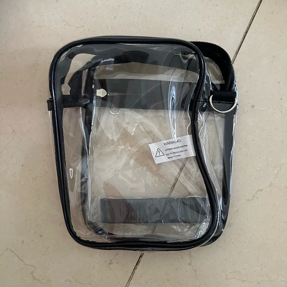 Clear Black Trim Crossbody Bag. Offers welcome